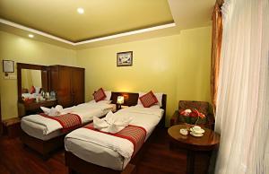 Voodi või voodid majutusasutuse Hotel Osho Home toas