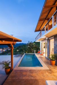 a swimming pool in the backyard of a house at Casa ChaChaCha in San Juan del Sur