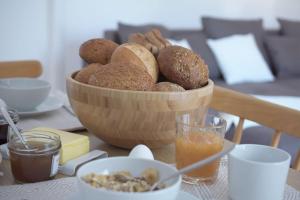 a bowl of bread and other foods on a table at Laubach Ferienwohnung - Fam.Lorenz in Laubach