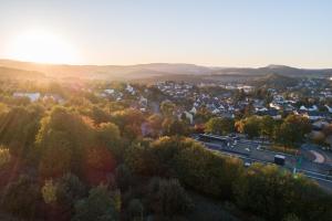 an aerial view of a small town with a road at Hotel Löwenstein in Gerolstein