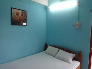 מיטה או מיטות בחדר ב-Hotel Lalaji Bayview