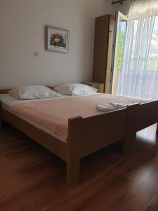 Postel nebo postele na pokoji v ubytování Apartments Davorka