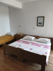 Postel nebo postele na pokoji v ubytování Apartments Davorka