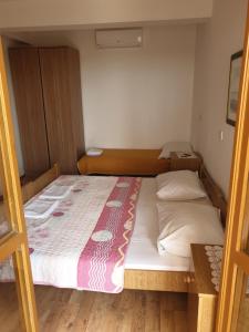Postel nebo postele na pokoji v ubytování Apartments Davorka