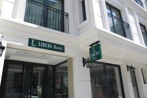 a building with signs on the side of it at Liberi Hotel Taksim in Istanbul