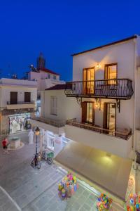 a view of a building with a swimming pool at Archontissa House in the Old Town in Rethymno Town