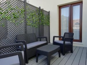 two chairs and two chairs on a patio at New Point Opera in Madrid