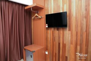 TV a/nebo společenská místnost v ubytování De House Hotel