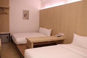Postel nebo postele na pokoji v ubytování De House Hotel