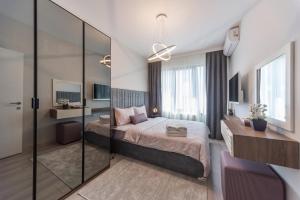 Postel nebo postele na pokoji v ubytování Green Hills Suites + 37 fotografií