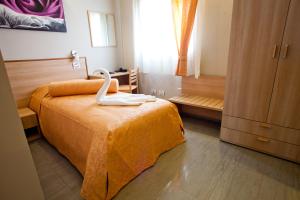 Postel nebo postele na pokoji v ubytování Motel Karibe