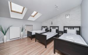 Posteľ alebo postele v izbe v ubytovaní Deluxe Apartments Kraków Brzozowa by Noclegi Renters + 28 fotografií
