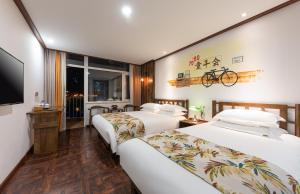 Nostalgia Hotel Near Tianjin Polar Ocean Word- Tianjin Fonte Joy World, 10 minutes drive away from Tianjin Tanggu High-Speed Railway Station, Free ice-cream, mineral water, snacks and laundry service, English communication well客房内的一张或多张床位