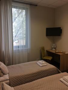 Ένα ή περισσότερα κρεβάτια σε δωμάτιο στο 3Rooms