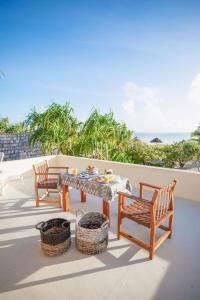 Un balcón o terraza de Zanzibar White Sand Luxury Villas & Spa - Relais & Chateaux