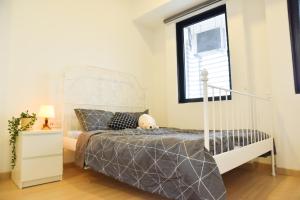 Postel nebo postele na pokoji v ubytování Gt Home encorp strand residence (alpha ivf )