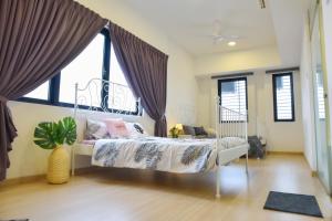 Postel nebo postele na pokoji v ubytování Gt Home encorp strand residence (alpha ivf )