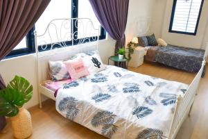 Postel nebo postele na pokoji v ubytování Gt Home encorp strand residence (alpha ivf )