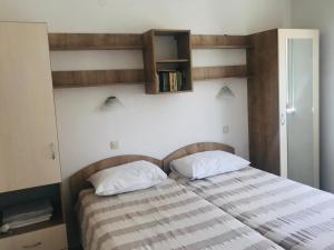 Posteľ alebo postele v izbe v ubytovaní San Rocco Lumbarda