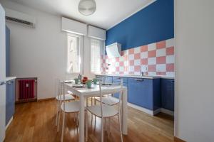 A kitchen or kitchenette at Sant'Orsola Colorful Huge Apartment