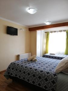 Postel nebo postele na pokoji v ubytování Hostal La Base