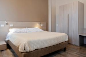 Postel nebo postele na pokoji v ubytování Magic Hotel