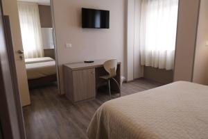 Postel nebo postele na pokoji v ubytování Magic Hotel