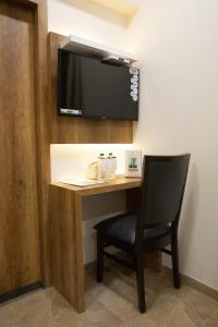 TV a/nebo společenská místnost v ubytování Hotel Grace Galaxy