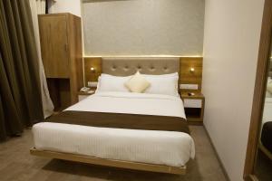 Postel nebo postele na pokoji v ubytování Hotel Grace Galaxy