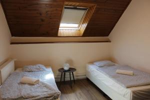 Postel nebo postele na pokoji v ubytování Natúra Panzió&Apartmanház