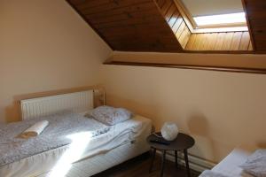 Postel nebo postele na pokoji v ubytování Natúra Panzió&Apartmanház