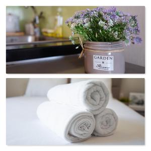 a bunch of towels and a pot of flowers at Saigon Banhada - Rivergate - Infinity Pool in Ho Chi Minh City