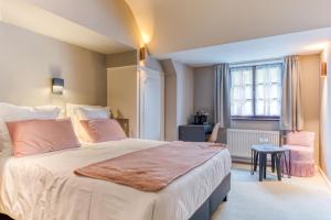 Postel nebo postele na pokoji v ubytování Hôtel Imperi'Ale