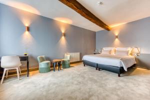 Postel nebo postele na pokoji v ubytování Hôtel Imperi'Ale