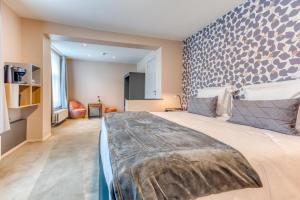 Postel nebo postele na pokoji v ubytování Hôtel Imperi'Ale