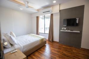 Postel nebo postele na pokoji v ubytování Hotel Grace Galaxy