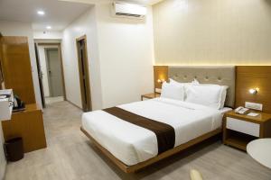 Postel nebo postele na pokoji v ubytování Hotel Grace Galaxy
