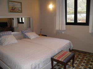 En eller flere senge i et værelse på Casa de Isora