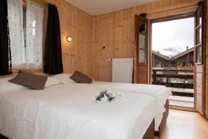 Katil atau katil-katil dalam bilik di Hotel de Moiry Supérieur