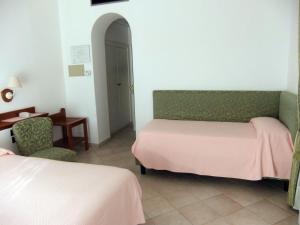 Voodi või voodid majutusasutuse Hotel Biancamaria toas
