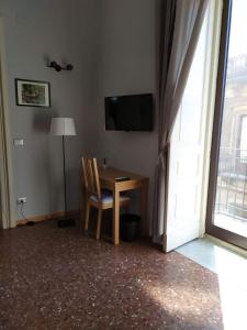 Televízia a/alebo spoločenská miestnosť v ubytovaní B&B A Casa Di GioSi