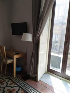 Televízia a/alebo spoločenská miestnosť v ubytovaní B&B A Casa Di GioSi