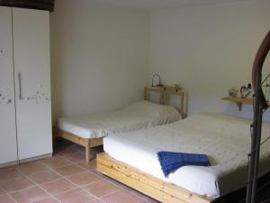 Giường trong phòng chung tại Belvedere Vacanze Toscana