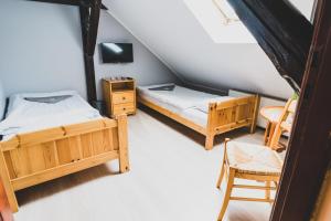 Postel nebo postele na pokoji v ubytování Zajazd Pod Lipami