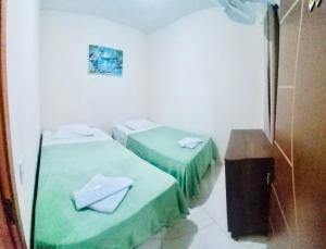 Tempat tidur dalam kamar di Hospedaria Casa da Lia