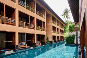 a swimming pool in front of a building at Avatar Railay in Railay Beach