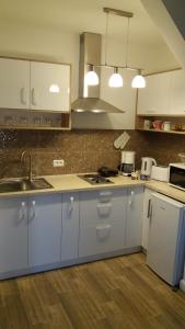 Una cocina o zona de cocina en Enjoy Apartment