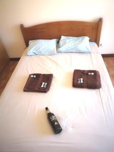 Кровать или кровати в номере Quarto com 4 camas (Beliches+ 1 Sofá-cama)