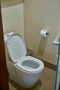 a bathroom with a toilet and a roll of toilet paper at Avatar Railay in Railay Beach