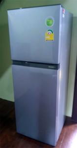 a small refrigerator with a sticker on the front of it at Yesterday Sathon in Bangkok